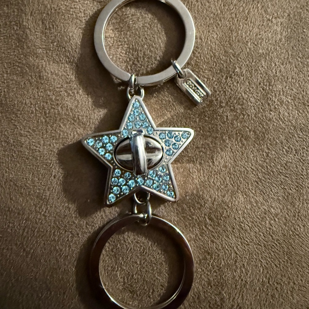 RARE NWOT Pair of Coach Vintage Silver Star with Blue Pave Swarovski Crystals.